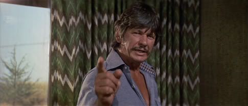 Charles Bronson - clearly not happy with the choice of curtains in this scene