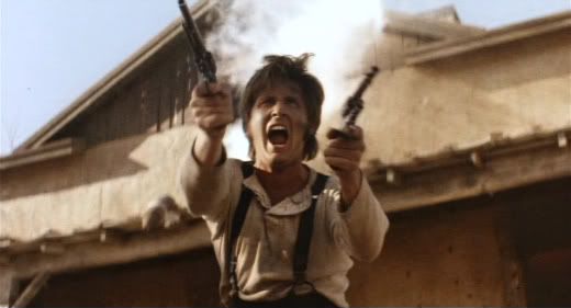 All guns blazing - Emilio Estevez as the Kid.