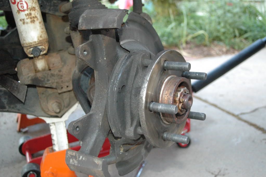 Brake rotors grinding against the knuckle and brake dust shield