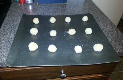 Peanut Butter Blossom Balls getting ready to go in the oven