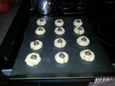 Peanut Butter Blossoms with freshly applied Hershey Kisses